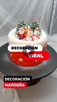 a christmas cake with santa clause decorations on top