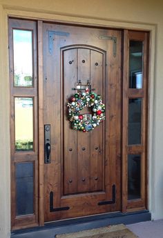 a wooden door with a wreath on it