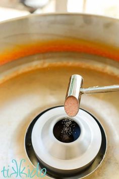 a close up of a metal sink with water in it