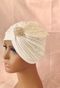 Unique White turban with brooch and feather, party gala turban ♥Beautiful turban that can jazz up any outfit instantly  ♥One size fits all ♥Please convo me for custom orders ♥ All items shown in my store are ready to ship  ♥Smoke free and pet free home studio ♥Favorite Fashionistas head piece a full head Turban hat ♥Stretch fabric, one size fits all ♥ Handwash only, Do Not Iron, Do Not Bleach WELCOME... My pieces are top quality in both materials and workmanship, and made with lots of love here Traditional White Headpiece For Party, Elegant White Headband Headwrap, Elegant White Headwrap Headband, Traditional White Party Headpiece, Elegant White Wedding Turban, Traditional Headband Fascinator For Party, Wedding Turban, Bohemian Hats, Head Turban