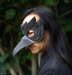 a person with a bird mask on their face