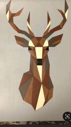 a deer head made out of geometric paper