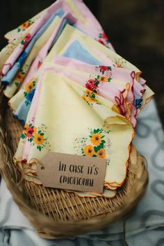 a basket filled with lots of napkins on top of a table