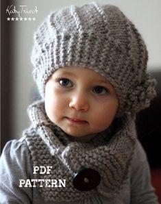 a little boy wearing a knitted hat and scarf with a button on the side