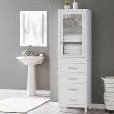 a bathroom with a white cabinet and sink