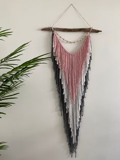 a wall hanging made out of different colored fringes