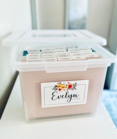 a plastic container with labels on it sitting on a counter