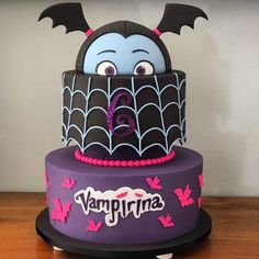 a birthday cake decorated to look like a bat