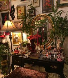 a living room filled with lots of furniture and plants on top of a wooden table