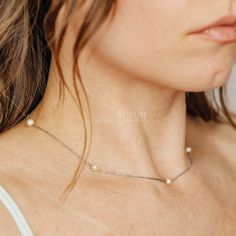 Indulge in the delicate elegance of our Dainty Pearl Station Necklace. Made with high quality pearl beads, this necklace is perfect for layering and adds a touch of sophistication to any outfit. It also makes a thoughtful gift for mothers and bridesmaids. Elevate your jewelry game with this must-have piece! * Material: High Quality Stainless Steel * Finish: Stainless Steel ∙ 18k Gold * Featuring a dainty 5mm Pearl Charms with adjustable cable chain 16 inches to 18 inches. * The pearls are availa Akoya Pearl Charm Beaded Necklaces For Wedding, Akoya Pearl Beaded Necklaces With Pearl Charm For Wedding, Wedding Akoya Pearl Beaded Necklaces With Pearl Charm, Wedding Akoya Pearl Beaded Necklace With Pearl Charm, Dainty Single Strand Beaded Necklaces For Wedding, Dainty Single Strand Beaded Necklace For Wedding, Elegant Akoya Pearl Beaded Necklaces For Wedding, Elegant Akoya Pearl Beaded Necklace For Wedding, Akoya Pearl Clavicle Chain Necklace For Wedding