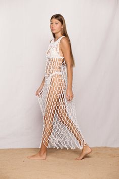 Description Details Care Return Sometimes less is more. Introducing the Bellano Dress. We might be biased, but this is easily the hero piece of our entire collection. Featuring a maxi length, bottom fringe detailing, and an all around wow factor for anyone who puts this on. Add to cart and checkout as fast as you can. This stunning, statement piece deserves to be worn over and over. This is what macrame dreams are truly made of.  The Bellano Dress is part of our macrame collection which offers three different length pieces that suit whichever style and occasion you decide to dress for.  Featured with Kumu 2 Top, Chiba Top, Papara Bottom and Malta One Piece HOW WE WEAR IT Chiba Papara Bellano Macrame Maxi Dress 100% Cotton Made in Indonesia Models wears size 1 Model is 5'9" / 175cm Bra size Vacay Vibes, Net Dress, Wow Factor, Less Is More, Dress 100, Dress Romper, Spring Collection, We Wear, Swimwear Tops