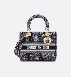 The Lady D-Lite bag combines classic elegance with House modernity. The style is fully embroidered with the season's signature black and white Plan de Paris motif, inspired by House archives and centered around Dior's historic address on Avenue Montaigne. The front features a Christian Dior Paris signature while the D.I.O.R. charms in pale gold-finish metal embellish and illuminate the silhouette. Equipped with a wide, reversible and removable embroidered shoulder strap, the medium Lady D-Lite b Elegant Top Handle Shoulder Bag With Embroidered Logo, Designer Embroidered Top Handle Bag, Elegant Double Handle Bag With Embroidered Logo, Luxury Embroidered Top Handle Shoulder Bag, Luxury Shoulder Bag With Embroidered Logo And Top Handle, Luxury Shoulder Bag With Embroidered Logo For Daily Use, Elegant Bags With Embroidered Logo For Everyday Use, Designer White Embroidered Bag, Luxury Double Handle Shoulder Bag With Embroidered Logo