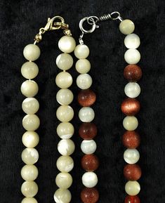 Presented are 4 beaded necklaces featuring genuine MOP (mother of pearl), carnelian, and gold stones. One of the necklaces feature a sterling silver clasp and another features a 14k yellow gold clasp, both are stamped as such. The other 2 necklaces feature a gold plated clasp and a bone clasp. 3 of the necklaces are fully beaded with MOP beads. The other necklace features a gold stone beads as well as genuine carnelian beads. The longest necklace measures 21 1/2 inches The shortest necklace meas Single Strand Mother Of Pearl Beaded Necklaces, Mother Of Pearl Round Beads Jewelry, Mother Of Pearl Beaded Necklaces With Polished Round Beads, Mother Of Pearl Beaded Necklaces, Fish Pendant Necklace, Jelly Opal, Carnelian Necklace, Locket Pendant Necklace, Saltwater Pearls