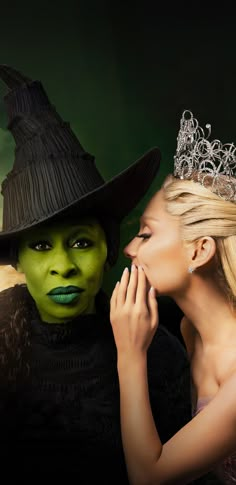 a woman in a witch costume next to a man with a green face and black hat