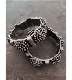 "\"Grab this beautiful black polish Kada and match it with any of the ethnic/ Indo western outfits, and look unique in crowd. This Kada/bracelet combines intricate detailing in a geometric line motif and contemporary design to help you make heads turn. The technique of oxidization has been used to give a dull sheen and bring out the exquisite design. This beautiful German silver bracelet is free of lead and nickel. These gorgeous pieces won't cause any skin rash or irritation. This bracelet is o Vintage Oxidized Finish Bracelets For Festivals, Traditional Adjustable Bracelets With Motifs, Adjustable Traditional Bracelets With Motifs, Vintage Oxidized Bracelets For Festivals, Vintage Oxidized Finish Bangle For Festivals, Vintage Oxidized Bangle For Festival, Bohemian Metal Bangle With Intricate Design, Festive Fusion Style Metal Bangle, Bohemian Bracelets With Latkans For Diwali