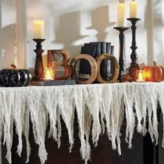 a table topped with candles and halloween decorations