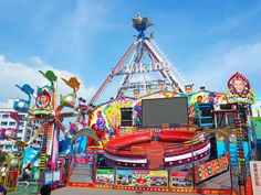 the carnival rides are brightly decorated and ready for people to ride