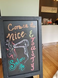 a chalkboard sign with writing on it