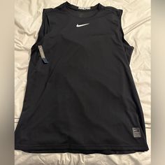 Brand New With Tag Nike Pro Sleeveless Shirt Xl Slim Fit Black Tank T-shirt For Sports, Sporty Sleeveless T-shirt For Sports Events, Black Short Sleeve Sports Tank Top, Black Sporty Sleeveless Muscle Tee, Black Sleeveless Sporty Muscle Tee, Functional Black Sleeveless Tops, Functional Sleeveless Top For Sports Events, Sporty Sleeveless Tops For Sports Events, Black Tank Top For Sports Events