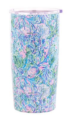 a blue and pink tumbler cup with floral designs on it's side, in front of a white background