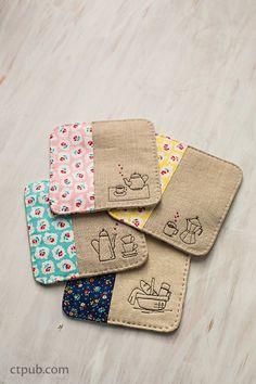 four small wallets with different designs on them