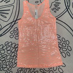 Sequin Tank Top In A Bright Neon Orange And Cream Design Sequins Are Very Light & Appears Different Depending On Lighting (Please See Photos For Different Angles) Stretch Orange V-neck Top, Orange Stretch V-neck Top, Orange Stretch Summer Tops, Spring Orange Stretch Tops, Fitted Peach Top For Party, Peach Party Tops For Spring, Peach Party Top For Spring, Spring Orange V-neck Tank Top, Orange Stretch Summer Tank Top