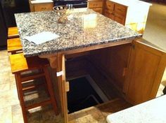 a kitchen with an oven, sink and dishwasher in the middle of it