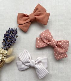 Make your child's outfit pop with a cute and sassy handmade hair bow. Handcrafted with cotton material in various patterns and fixed with a durable and painless alligator clip. At 8 cm, this kids hair bow will make a statement at your little one's next occasion. Love the look and want a headband? Check out our interchangeable nylon headband here. https://www.etsy.com/listing/1152709247/soft-nylon-headband-for-toddlers-and?click_key=81ae301e0003cc825a6e9bbbf86270bbf1ff1775%3A1152709247&click_sum= Baby Hair Bow, Hair Bow Clips, Kids Hair Bows, Cotton Hair, Hair Bow Clip, Toddler Hair Bows, Bows Hair, Handmade Hair Bows, Baby Hair Bows