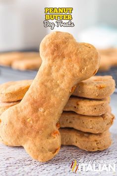 a stack of peanut butter dog treats sitting on top of a table