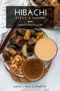 two plates filled with meat and veggies next to dipping sauce on the side