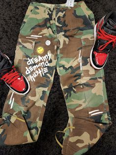 "Dreams demand hustle hand painted camo pants. Size Medium regular, waist 31\"-35\"" Camo Outfits Mens, Camo Pants Outfit Men, Camo Pants Men, Cargo Pants Outfit Men, Black Fact, Pants Outfit Men, Color Pallete, Camo Outfits, Cargo Pants Outfit