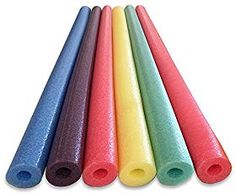 six different colored yoga mats lined up in a row