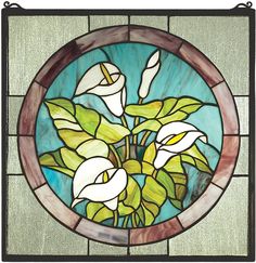 a stained glass window with white flowers and green leaves