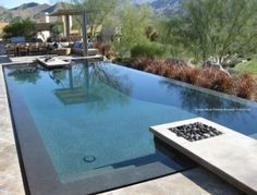 an empty swimming pool in the middle of a desert