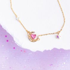 Our Lovesick Necklace is not for the faint of heart. This necklace pairs perfectly together with our Lovesick Dangle Earrings to give you a look that is out of this world! 18k gold plated, 18k rose gold plated, or rhodium plated over brass with a protective coating Cubic zirconia stones. Gradient stones may vary in hues of pink, purple and blue. 16" chain with a 2" extension Shop our entire Gradient Stones Collection here Cute Clavicle Chain Jewelry For Party, Elegant Heart-shaped Moon Charm Jewelry, Elegant Heart-shaped Jewelry With Moon Charm, Cute Heart Shaped Clavicle Chain Jewelry, Cute Clavicle Chain Jewelry For Valentine's Day, Cute Heart Shaped Clavicle Chain, Cute Heart-shaped Clavicle Chain, Whimsical Pink Sterling Silver Jewelry, Whimsical Pendant Jewelry For Party