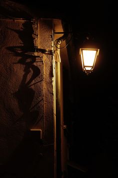 a street light on the side of a building