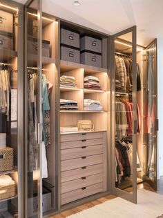 a walk in closet filled with lots of clothes