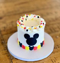 a mickey mouse cake on a white plate