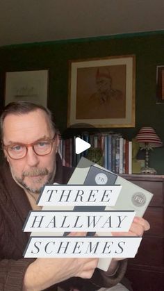 a man holding up three different books in front of him and the words three hall way schemes