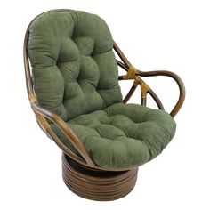 a green chair and ottoman sitting on top of a wooden table next to each other