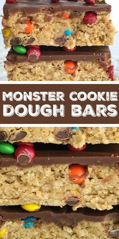 monster cookie dough bars stacked on top of each other with chocolate and candy in the middle