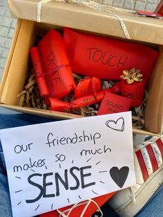 a box filled with lots of red boxes and some writing on the side of it