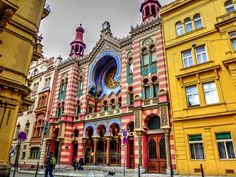 an old building with many windows and colorful architecture