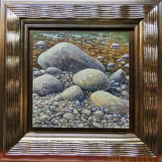 a painting of rocks and grass in a frame