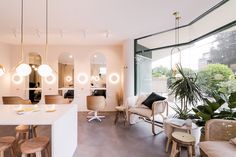 a living room filled with furniture and mirrors