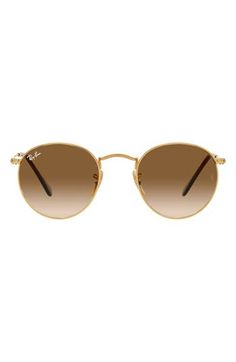 Complete your look with the glam, throwback style of rounded sunglasses featuring flashy metallic frames and gradient lenses. 50mm lens width; 21mm bridge width; 145mm temple length 100% UV protection Metal Made in Italy Ray-Ban style number: RB3447 Gold Round Sunglasses With Polarized Lenses, Gold Round Sunglasses With Tinted Lenses, Gold Round Sunglasses With Gradient Lenses, Modern Aviator Sunglasses With Gradient Round Frame, Modern Aviator Sunglasses With Gradient Lenses, Women’s Sunglasses, Rayban Sunglasses For Women, Fashion Eye Glasses, Brown Gradient