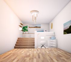 a room with wooden floors and stairs leading up to the top floor is shown in this image