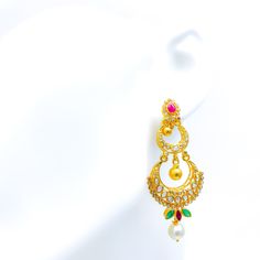 These stunning 22k gold hanging earrings, weighing a total of 20.4 grams with a gold net weight of 18.7 grams, feature a decadent dual crescent design adorned with uncut diamonds (Polki), rubies, emeralds, and pearls. The yellow gold finish enhances their luxurious appeal, making them perfect for any special occasion. The uncut diamonds, totaling 3.25 carats, come in irregular oval and round shapes, adding unique sparkle. Complementing the diamonds are rubies, emeralds, and pearls, weighing 5.1 carats and shaped in pear, marquise, and sphere forms, adding a touch of color and elegance. With a length of 2.5 inches and a hanging style, these earrings offer a grand and comfortable fit, secured with screw-back posts. Ideal for those who appreciate high-quality craftsmanship and timeless beauty 22k Gold Chandbali Earrings For Diwali, Heavy 22k Gold Chandbali Earrings, Festive 22k Gold Hand Set Chandbalis, Bollywood Style Chandbali Filigree Earrings, 22k Gold Hand Set Chandbalis As Gift, Hand Set 22k Gold Chandbalis As Gift, Gold Bollywood Ruby Jhumkas, Bollywood Style Gold Ruby Jhumkas, 22k Gold Round Chandbalis For Celebrations