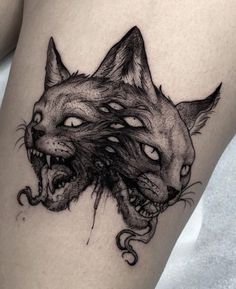 a woman's thigh with an animal tattoo on it