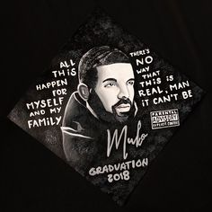 a black and white photo of a man's graduation cap with words on it